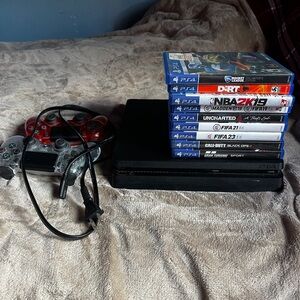 Sony PlayStation 4 Console with games and controllers